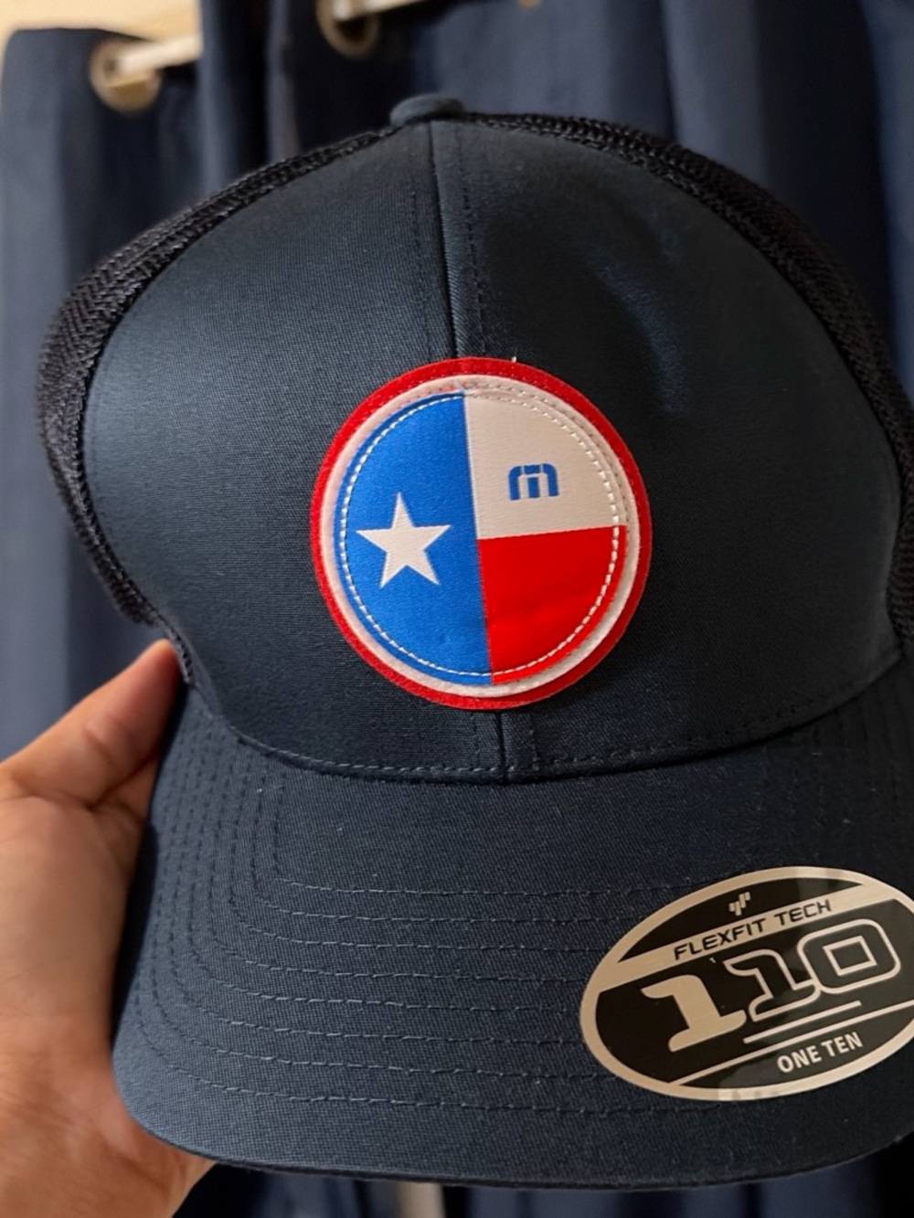Travis Mathew Navy Blue Trucker Hat with Red, White & Blue Patch
